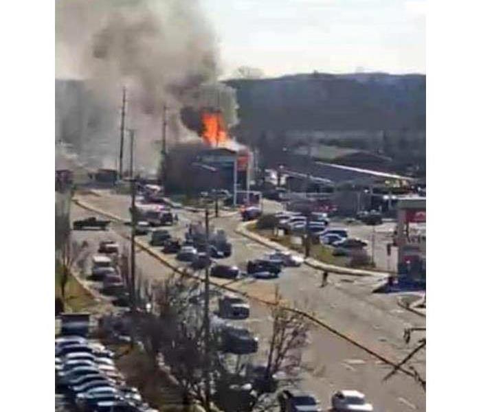 Long view of a building on fire