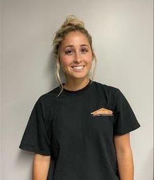 Young lady standing with a black SERVPRO T-shirt on